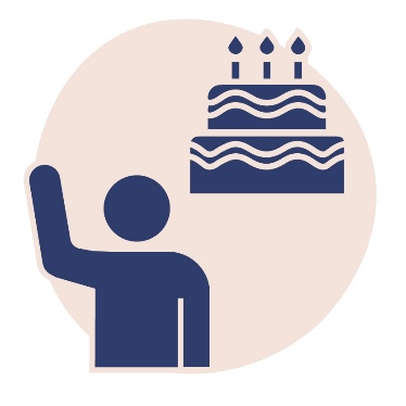 A person with their arm raised and a birthday cake.