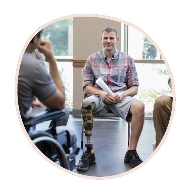 A person with disability in a meeting with other people.