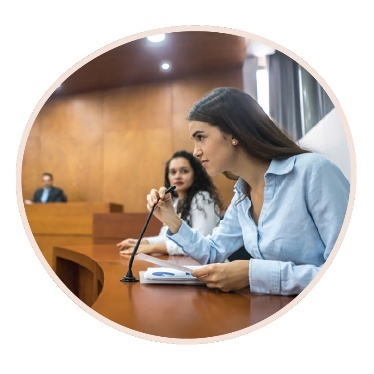 A person using a microphone in a hearing.
